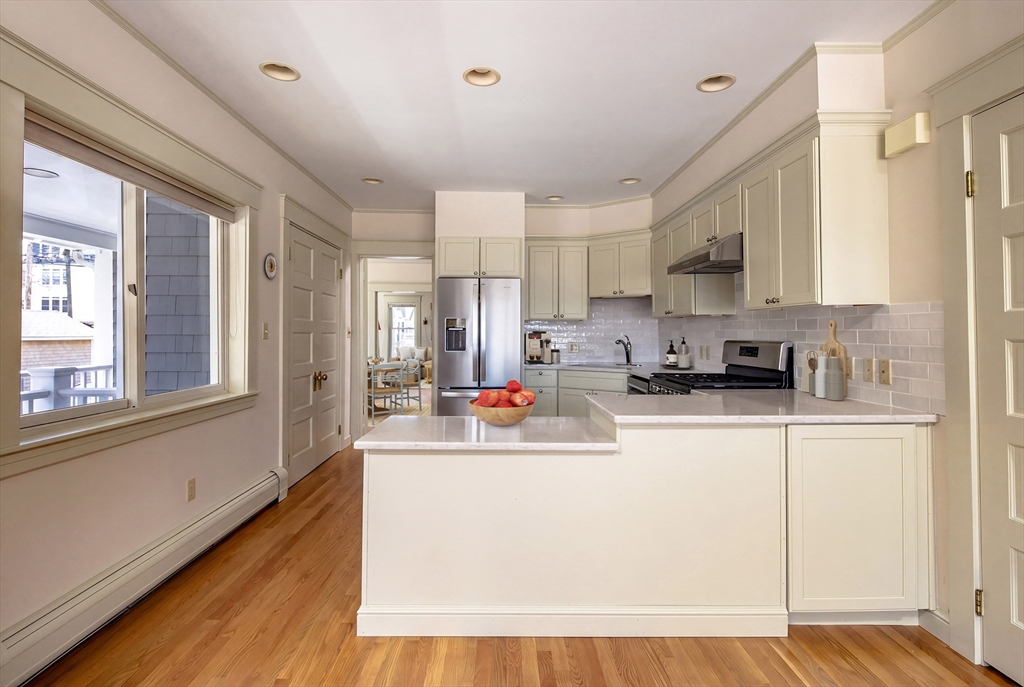 329 Front Street Marion, MA 02738 - Photo 23 of 42 a kitchen with stainless steel appliances a sink a stove a refrigerator cabinets and a window