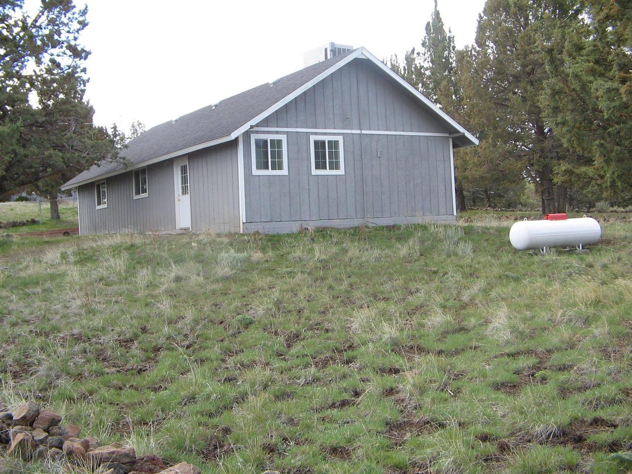 713 County Rd 214 Canby, CA 96015 - Photo 3 of 7 a backyard of a house with table and chairs