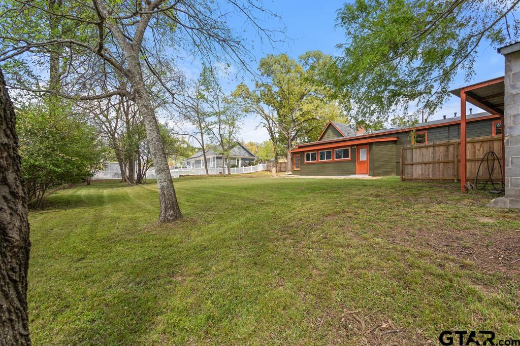 2819 New Copeland Road Tyler, TX 75701 - Photo 32 of 39 a view of an house with backyard space and garden