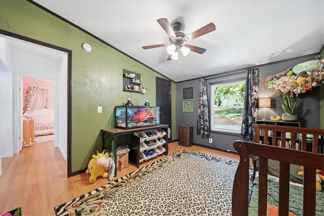 1014 Harris Road Anderson, SC 29625 - Photo 20 of 34 Hardwood flooring and a refreshing ceiling fan elevate the comfort of this charming bedroom.
