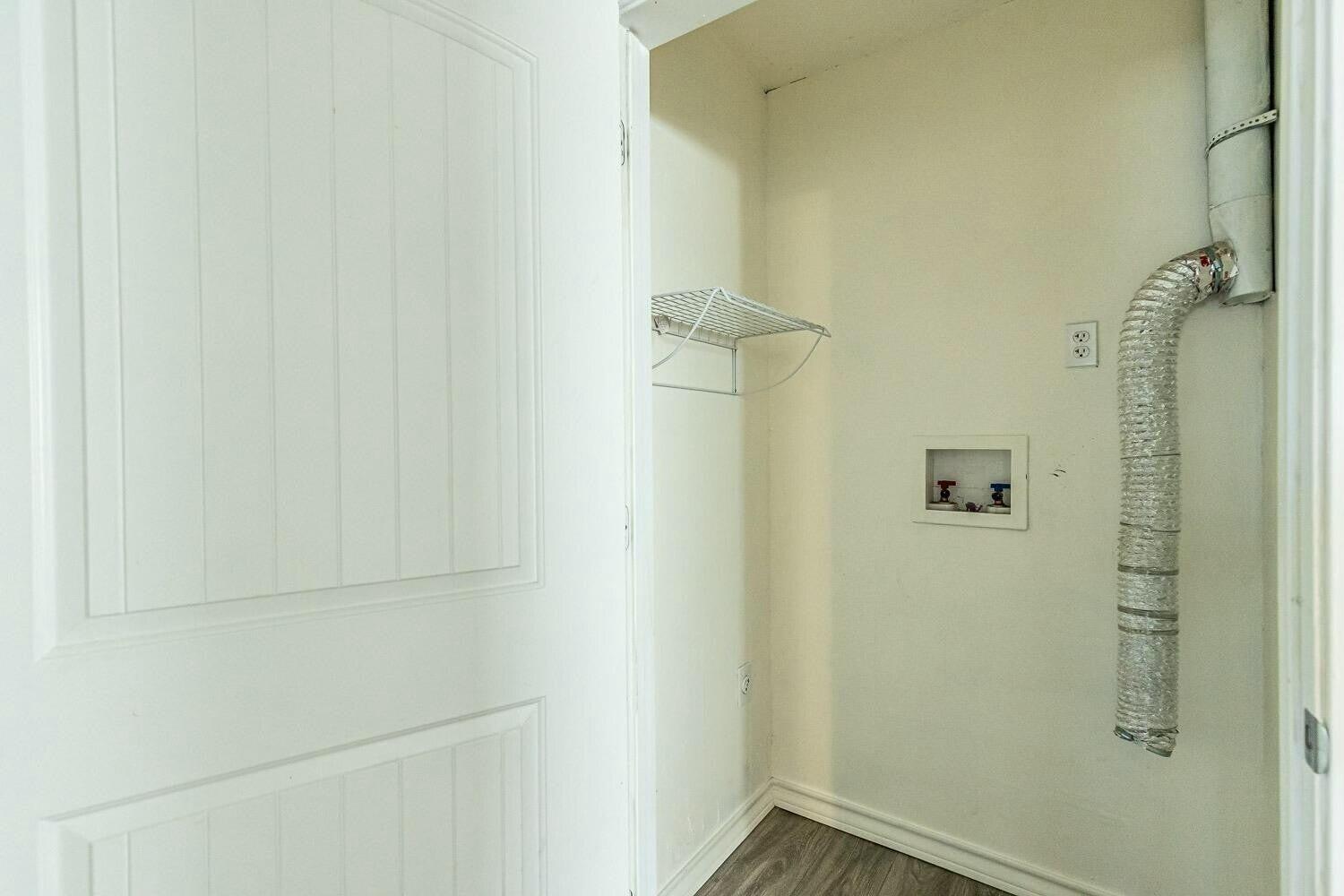 4320 48th Street Lubbock, TX 79413 - Photo 13 of 17 a bathroom with a window
