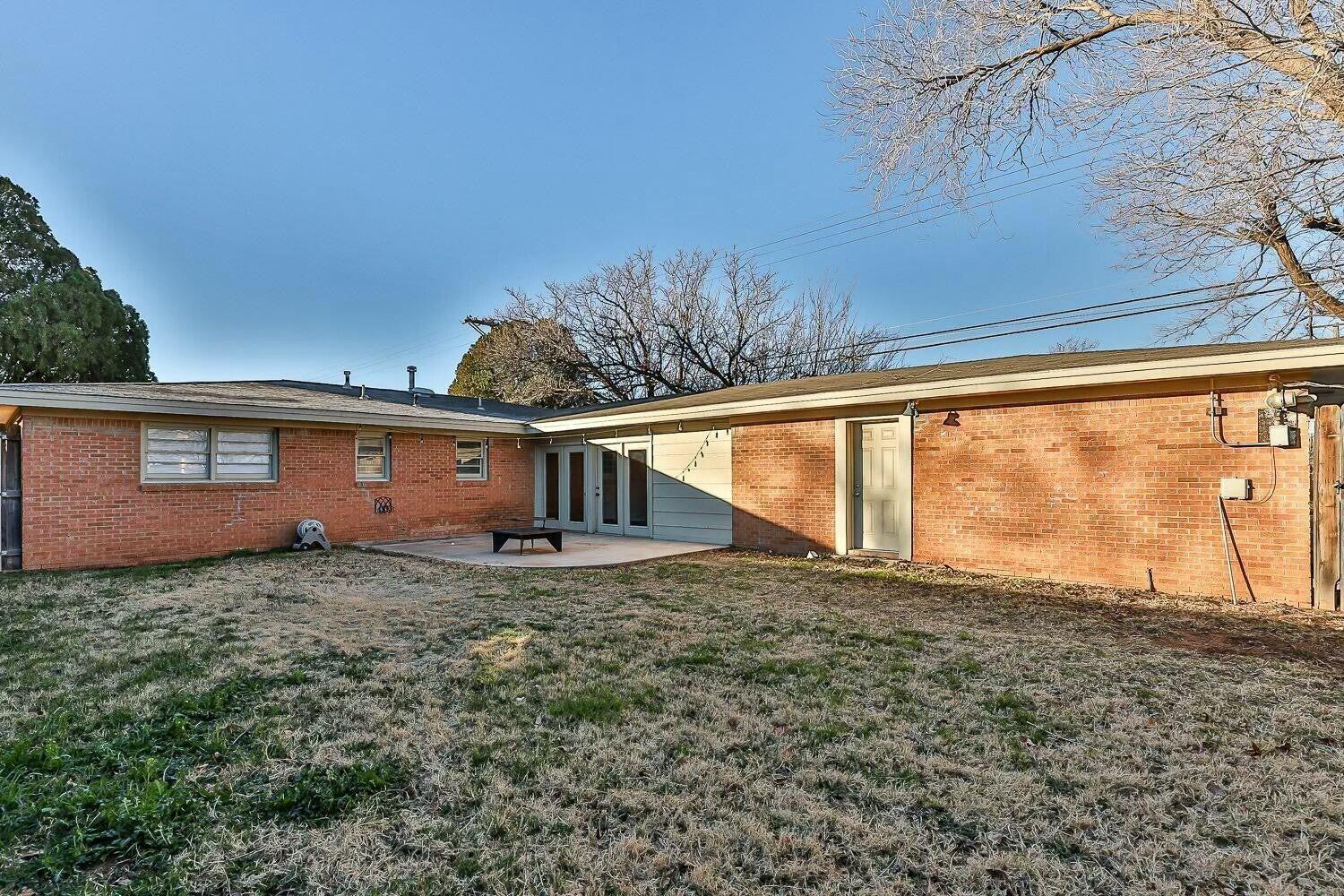 4320 48th Street Lubbock, TX 79413 - Photo 16 of 17 a view of a house with a yard
