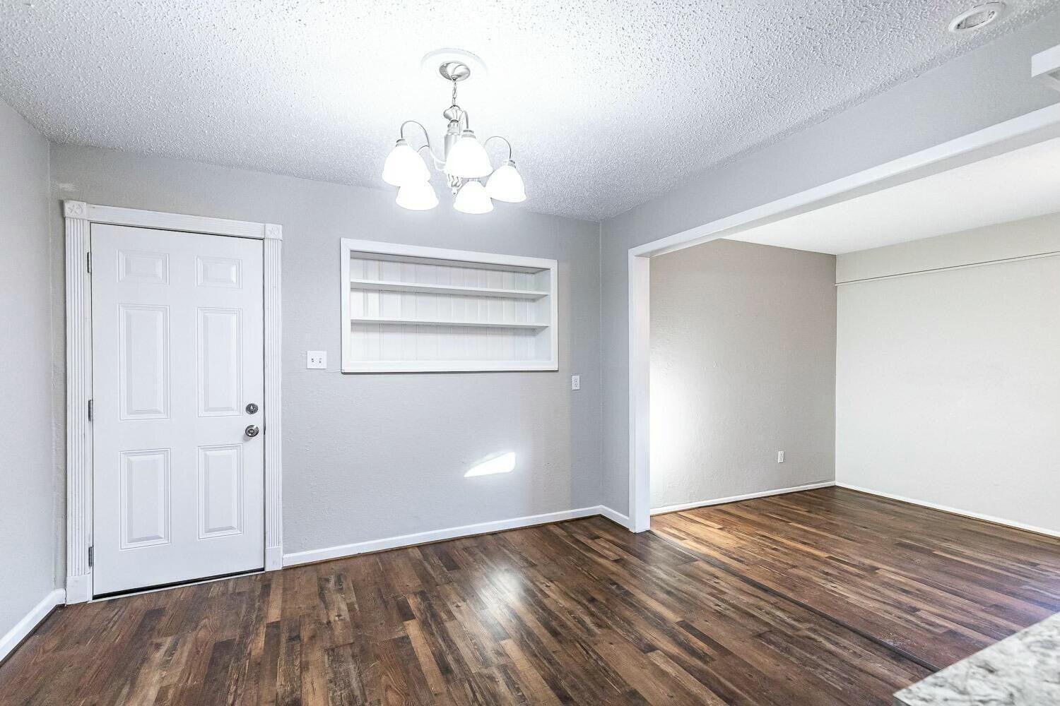 4320 48th Street Lubbock, TX 79413 - Photo 6 of 17 a view of empty room with wooden floor