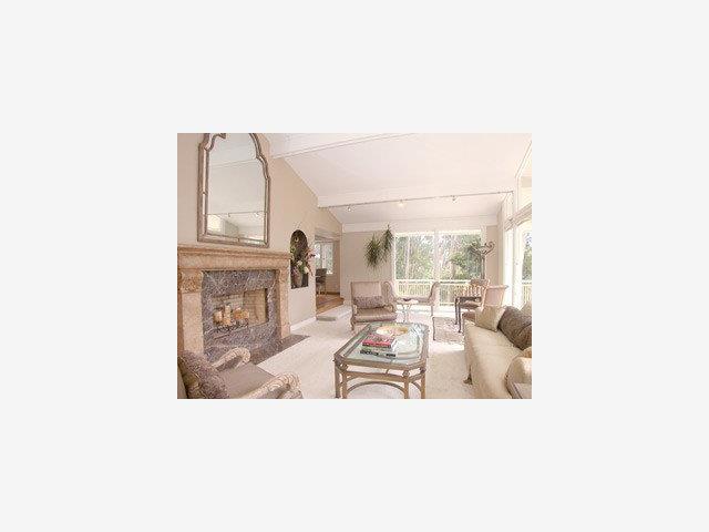 440 Pinehill Road Hillsborough, CA 94010 - Photo 2 of 8 a living room with furniture and a fireplace