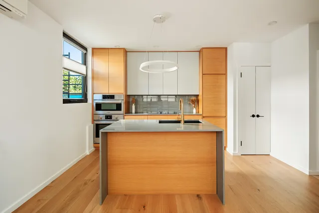 a view of a kitchen with a large window