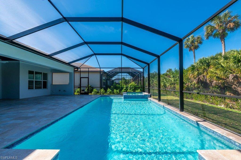 11863 Gardenia Avenue Naples, FL 34120 - Photo 1 of 50 a view of a house with backyard and porch