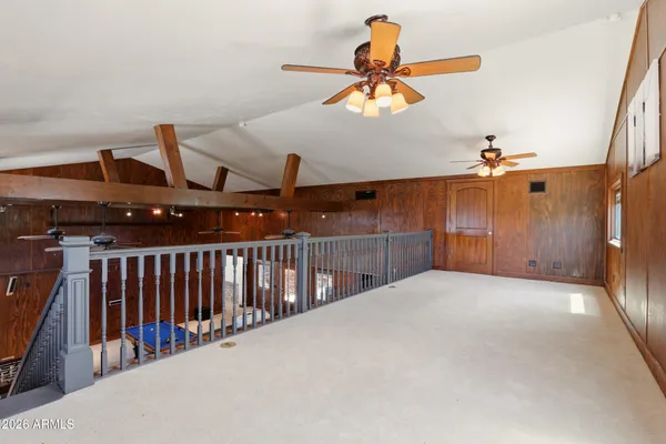 a kitchen with stainless steel appliances granite countertop a refrigerator a stove and a sink