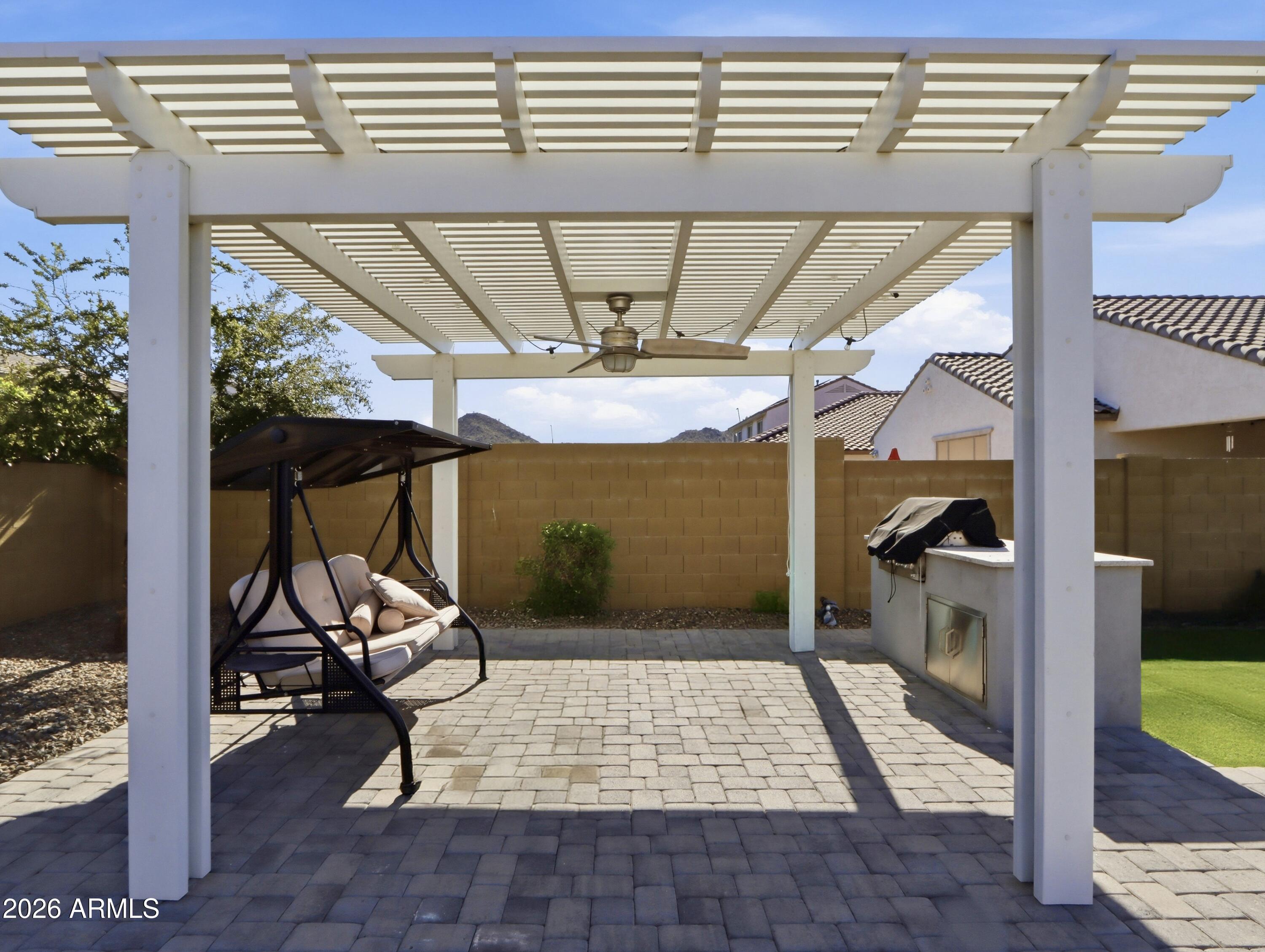 6421 Roy Rogers Road Phoenix, AZ 85083 - Photo 11 of 17 a view of a porch with a table and chairs