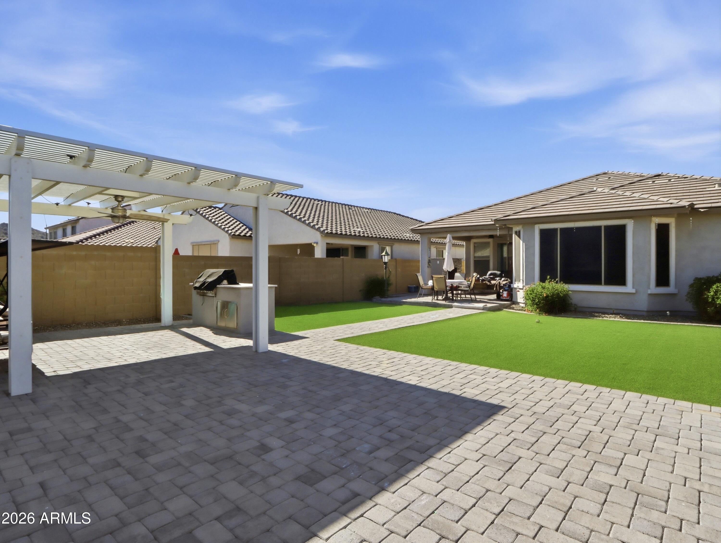 6421 Roy Rogers Road Phoenix, AZ 85083 - Photo 14 of 17 a front view of a house with a yard and garage