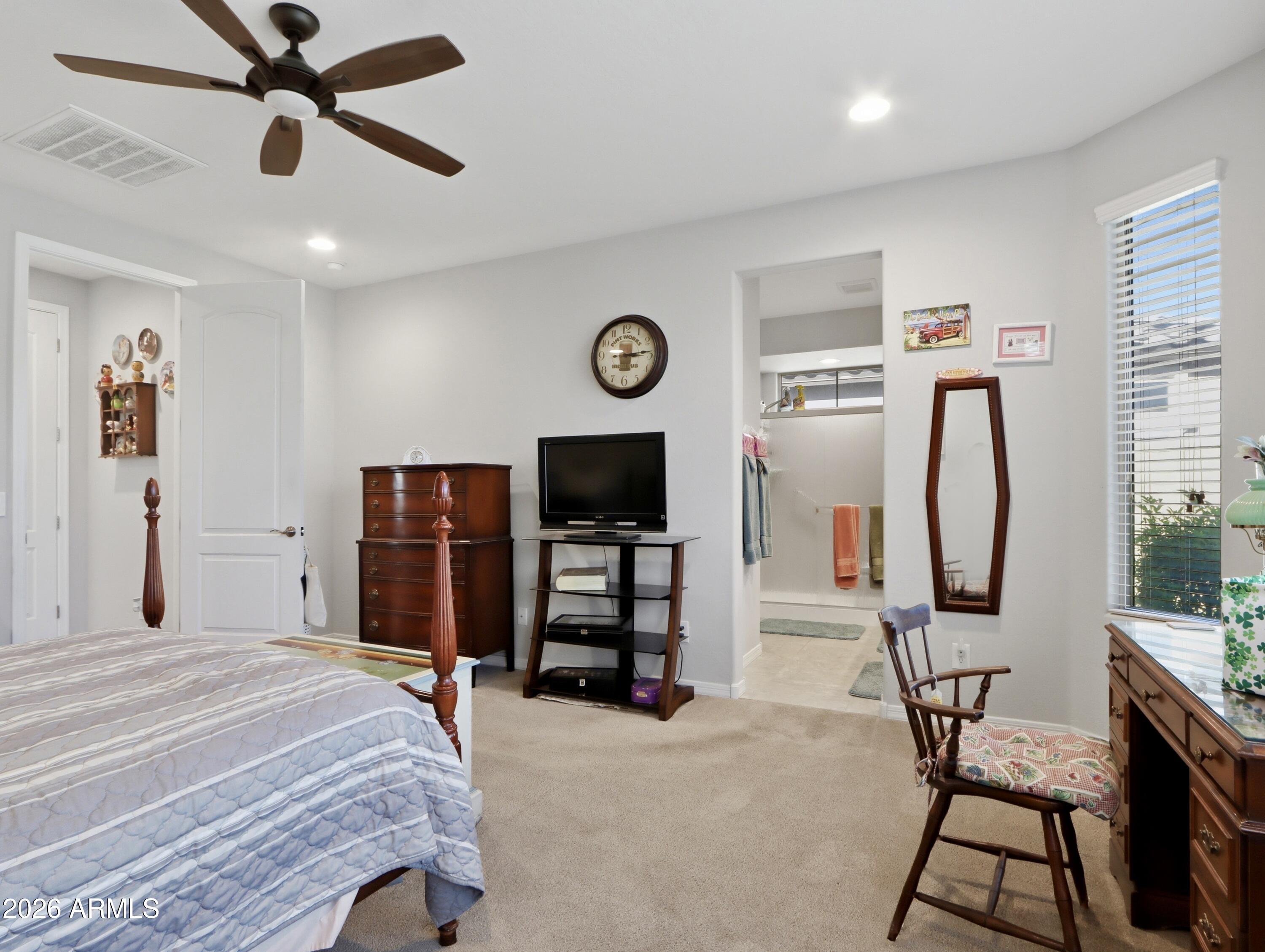 6421 Roy Rogers Road Phoenix, AZ 85083 - Photo 4 of 17 a bedroom with furniture and a window