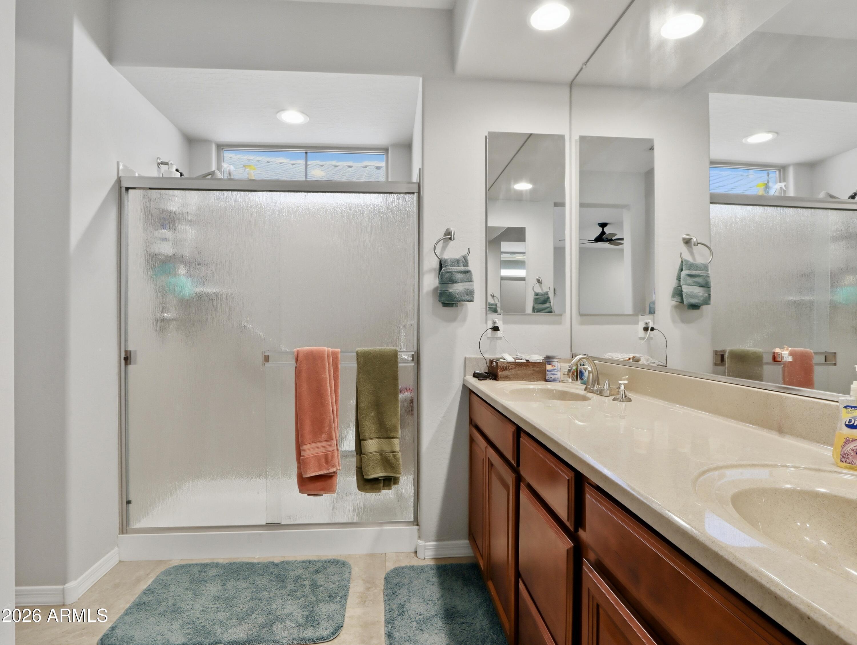 6421 Roy Rogers Road Phoenix, AZ 85083 - Photo 5 of 17 a bathroom with a tub sink and mirror
