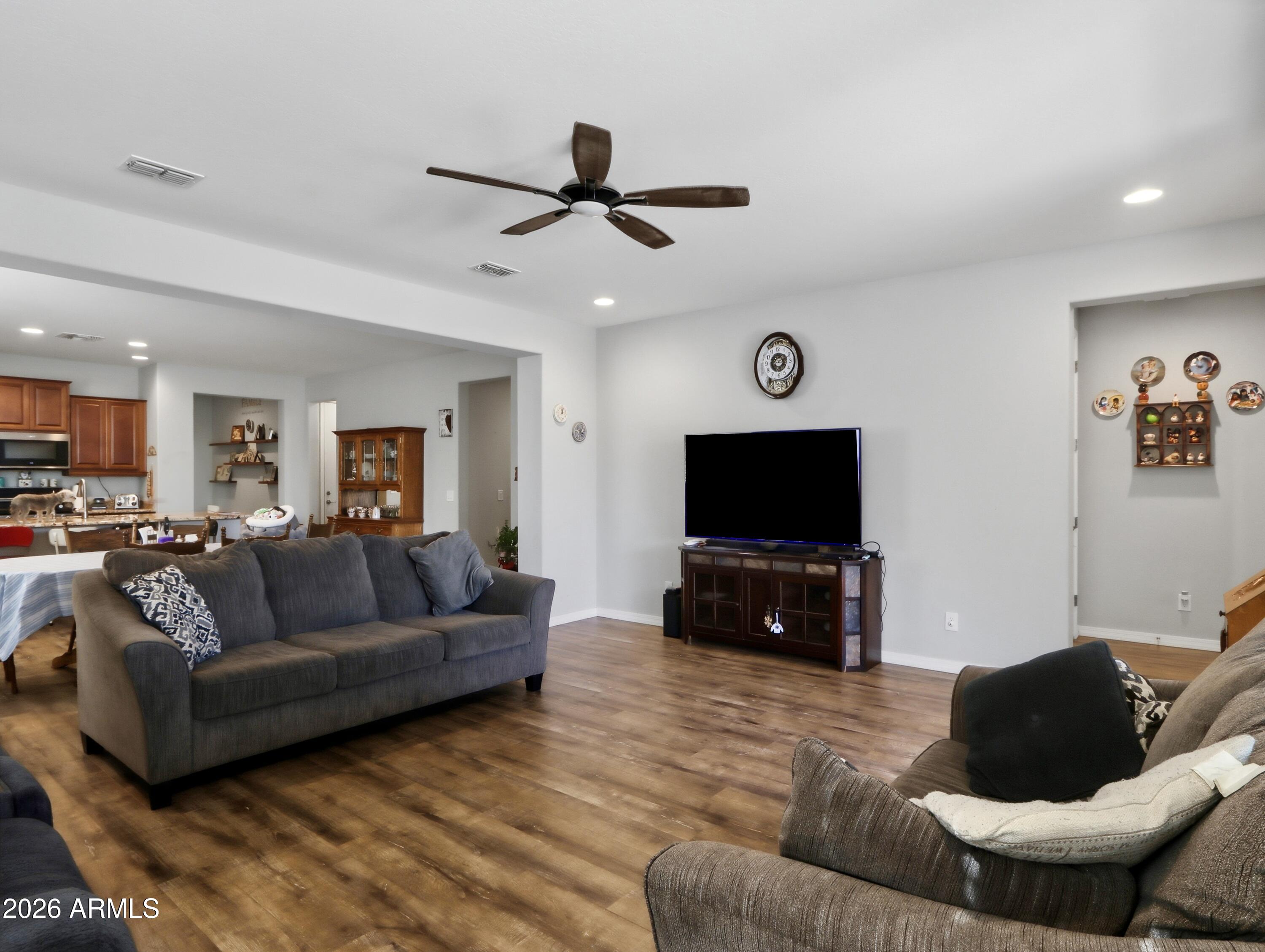 6421 Roy Rogers Road Phoenix, AZ 85083 - Photo 6 of 17 a living room with furniture and a flat screen tv