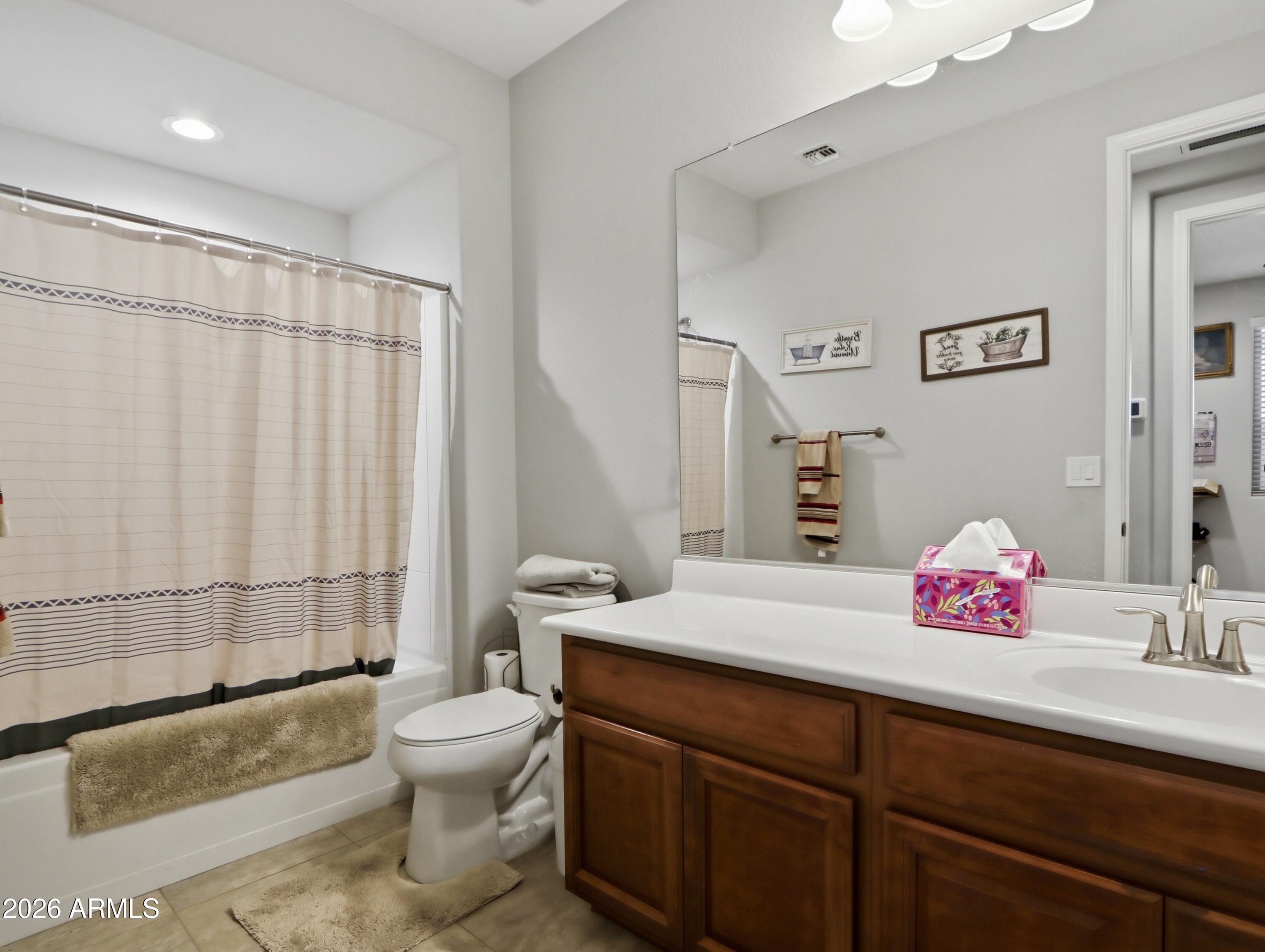 6421 Roy Rogers Road Phoenix, AZ 85083 - Photo 8 of 17 a bathroom with a sink a toilet and shower