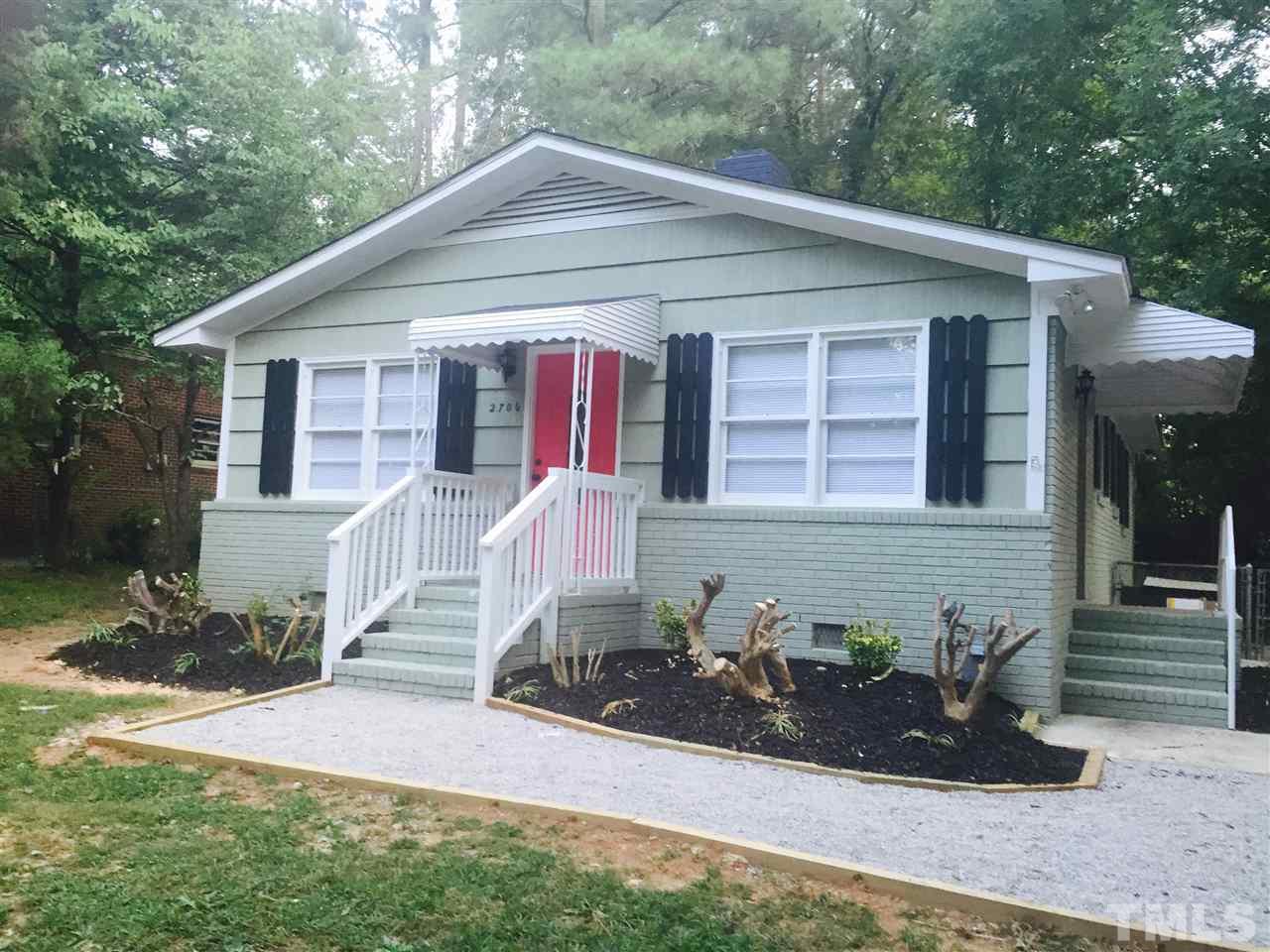 2706 Milburnie Road Raleigh, NC 27610 - Photo 1 of 8 a front view of a house with a yard