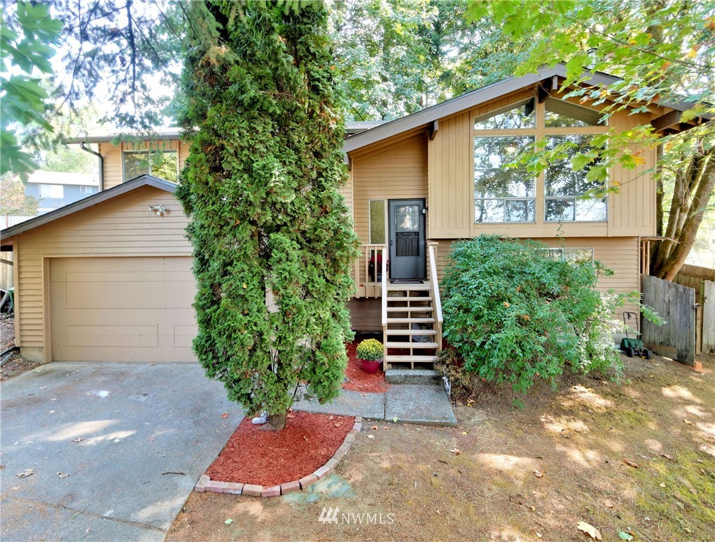 3619 Southeast 19th Court Renton, WA 98058 - Photo 1 of 21 a view of a back yard with a house