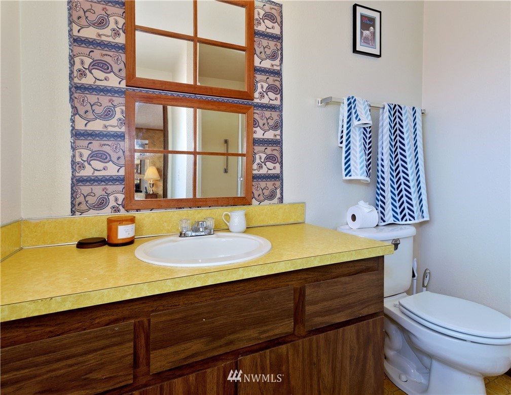 3619 Southeast 19th Court Renton, WA 98058 - Photo 11 of 21 a bathroom with a sink and a mirror