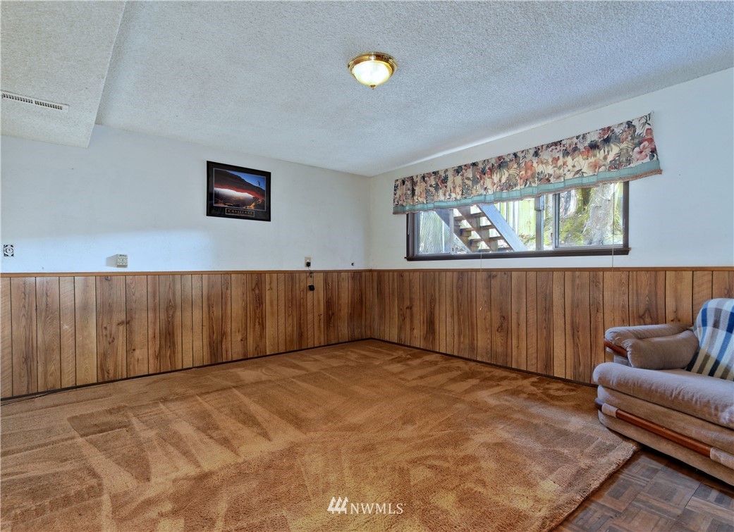 3619 Southeast 19th Court Renton, WA 98058 - Photo 16 of 21 a view of a livingroom with furniture and window