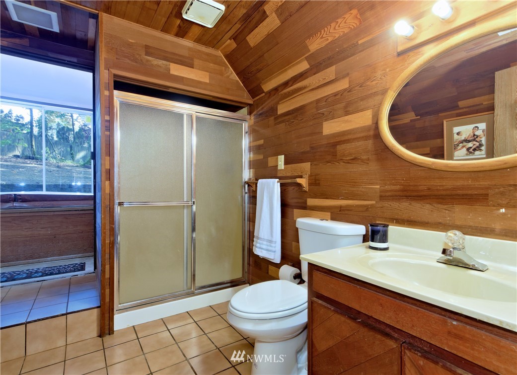3619 Southeast 19th Court Renton, WA 98058 - Photo 17 of 21 a bathroom with a sink a toilet and shower