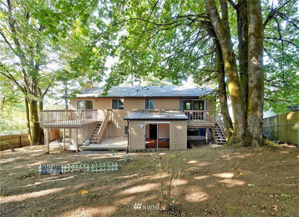 3619 Southeast 19th Court Renton, WA 98058 - Photo 19 of 21 a front view of a house with a garden