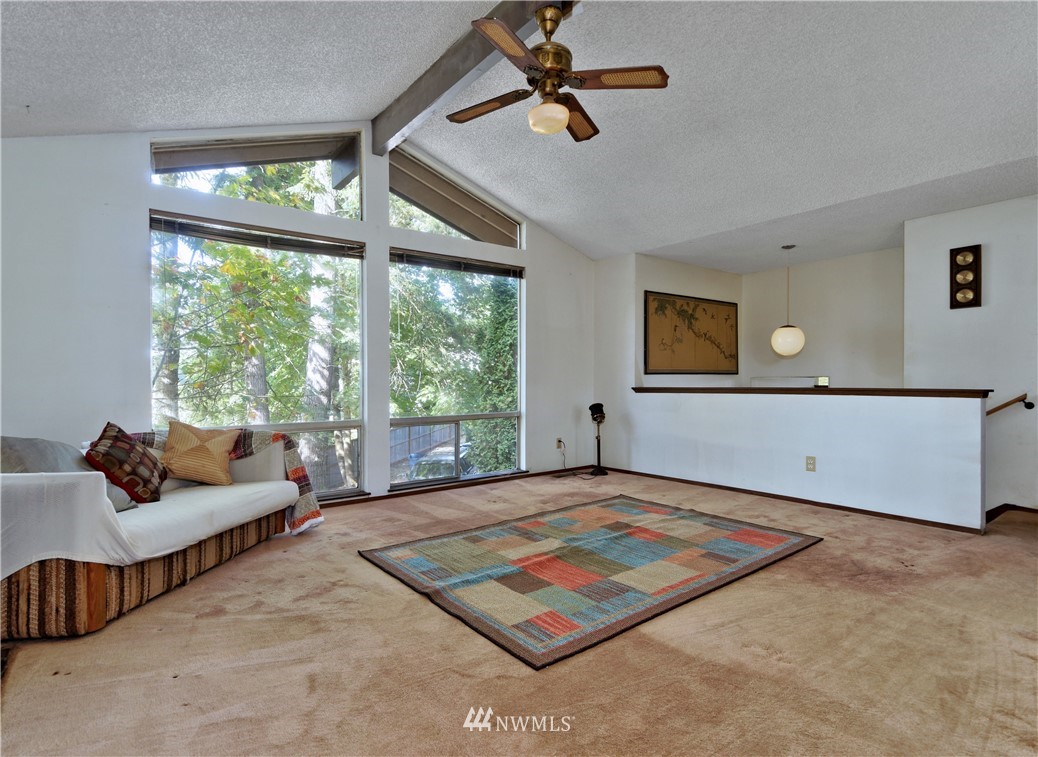 3619 Southeast 19th Court Renton, WA 98058 - Photo 4 of 21 a living room with furniture rug and a large window