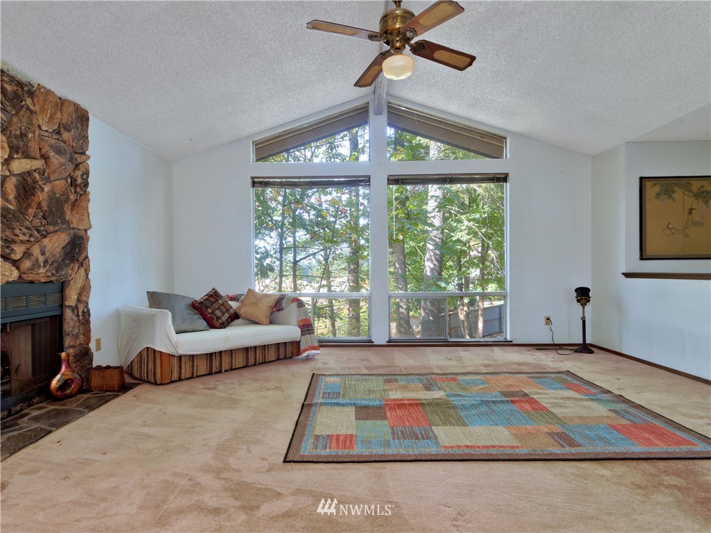 3619 Southeast 19th Court Renton, WA 98058 - Photo 5 of 21 a living room with furniture and a chandelier