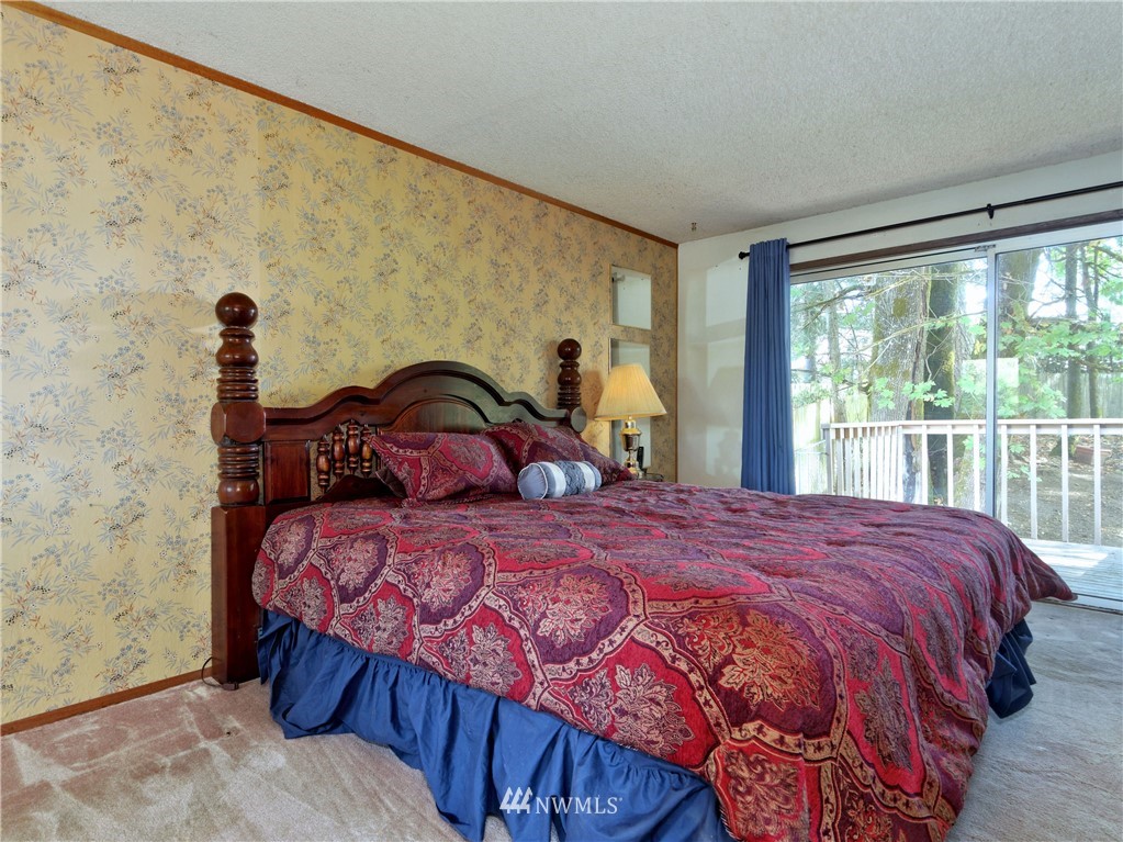 3619 Southeast 19th Court Renton, WA 98058 - Photo 10 of 21 a bedroom with a bed and a large window