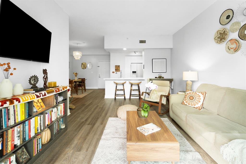 275 Northeast 18th Street, Unit 202 Miami, FL 33132 - Photo 14 of 20 a living room with furniture and a flat screen tv