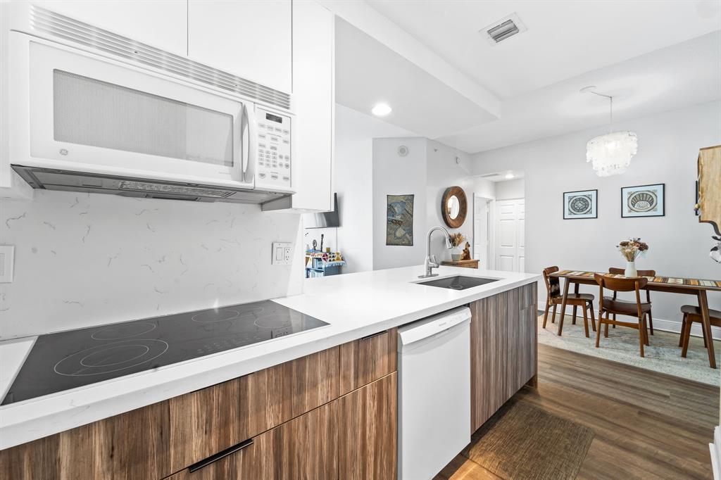 275 Northeast 18th Street, Unit 202 Miami, FL 33132 - Photo 4 of 20 a kitchen with a sink and cabinets