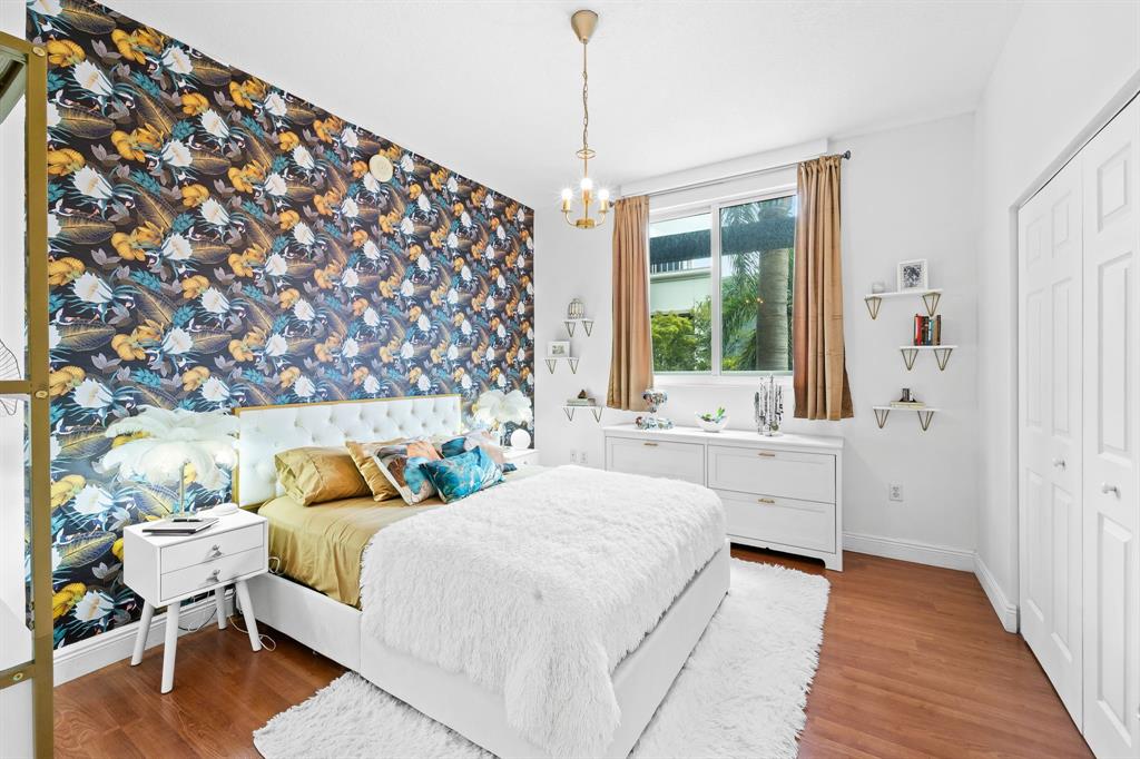 275 Northeast 18th Street, Unit 202 Miami, FL 33132 - Photo 7 of 20 a bedroom with a bed and a window