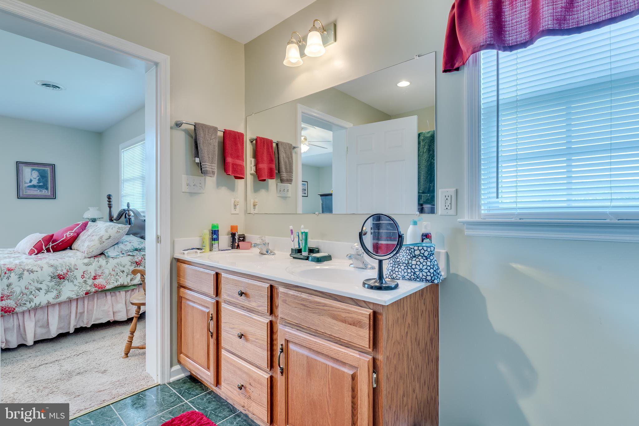1296 Spielman Road Berkeley Springs, WV 25411 - Photo 29 of 68 Master bath features double bowl vanity w/oak base