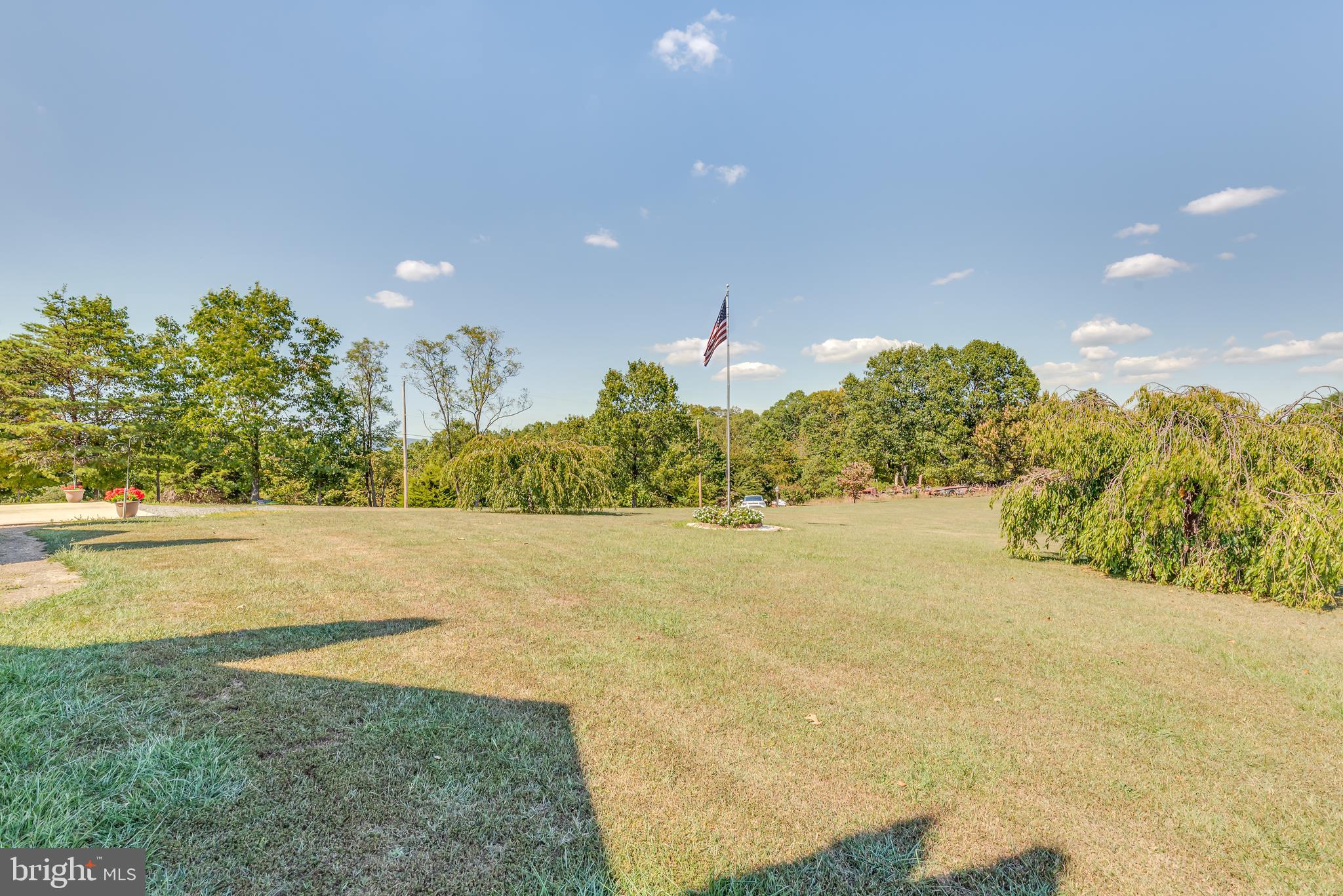 1296 Spielman Road Berkeley Springs, WV 25411 - Photo 46 of 68 Picturesque front yard is completed with flag pole