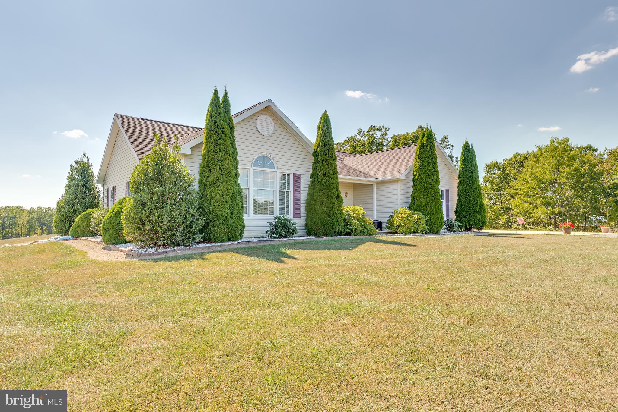 1296 Spielman Road Berkeley Springs, WV 25411 - Photo 47 of 68 and beautifully manicured landscaping with shrubs