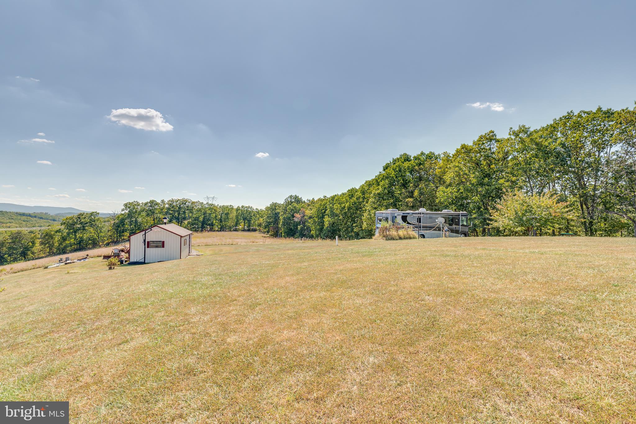 1296 Spielman Road Berkeley Springs, WV 25411 - Photo 50 of 68 Rear yard is expansive and level