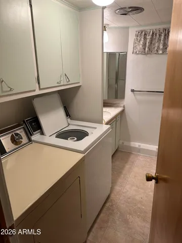 a kitchen with a refrigerator and a stove