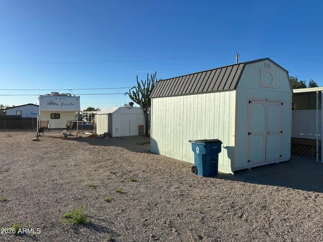 a view of a house with backyard and utility