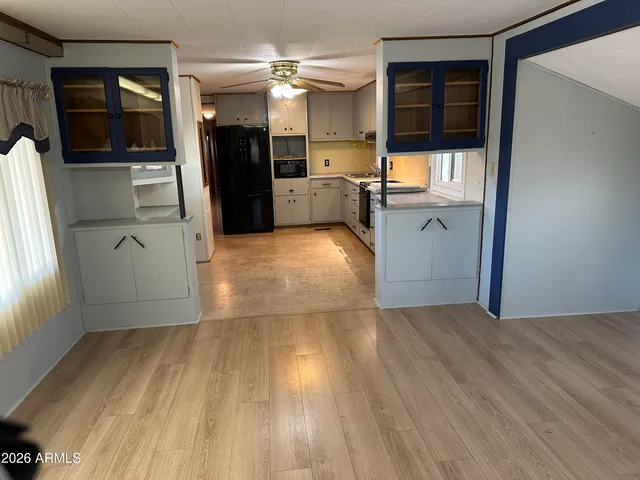 a view of a kitchen from the hallway