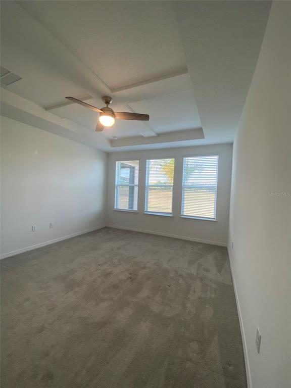 7047 Oxbow Road Minneola, FL 34715 - Photo 13 of 33 an empty room with a window