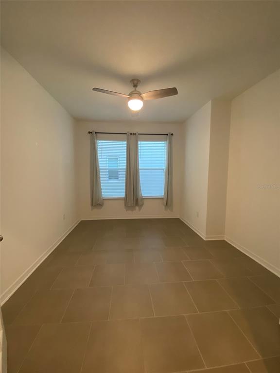 7047 Oxbow Road Minneola, FL 34715 - Photo 18 of 33 a view of an empty room with a window