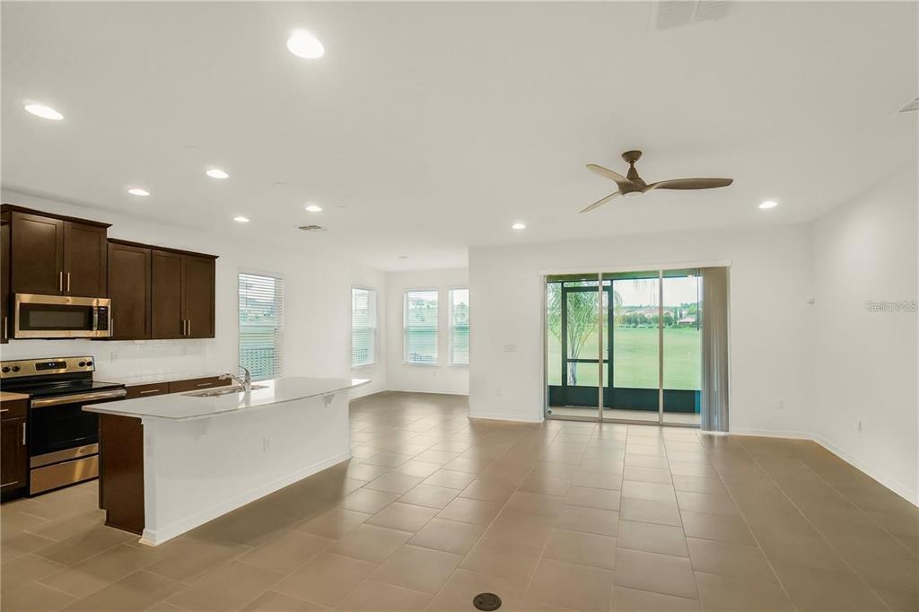 7047 Oxbow Road Minneola, FL 34715 - Photo 3 of 33 a view of an empty room with a window