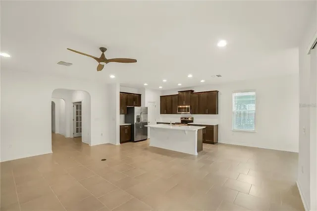 a view of a living room a livingroom with furniture and a window
