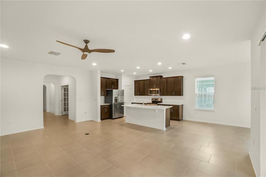 7047 Oxbow Road Minneola, FL 34715 - Photo 4 of 33 a view of a living room a livingroom with furniture and a window