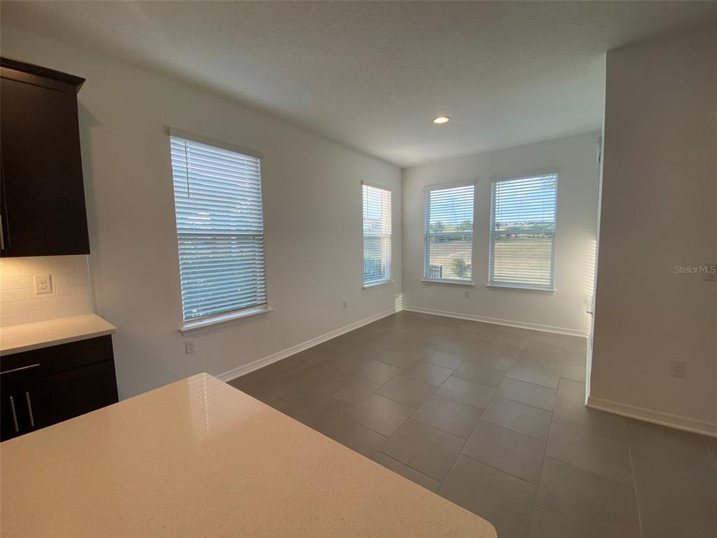 7047 Oxbow Road Minneola, FL 34715 - Photo 7 of 33 a view of an empty room with a window