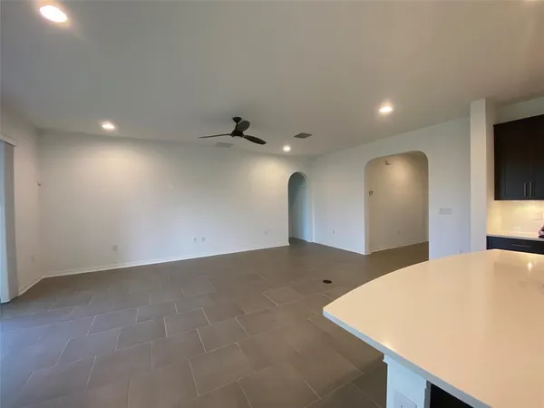 a view of kitchen and empty room