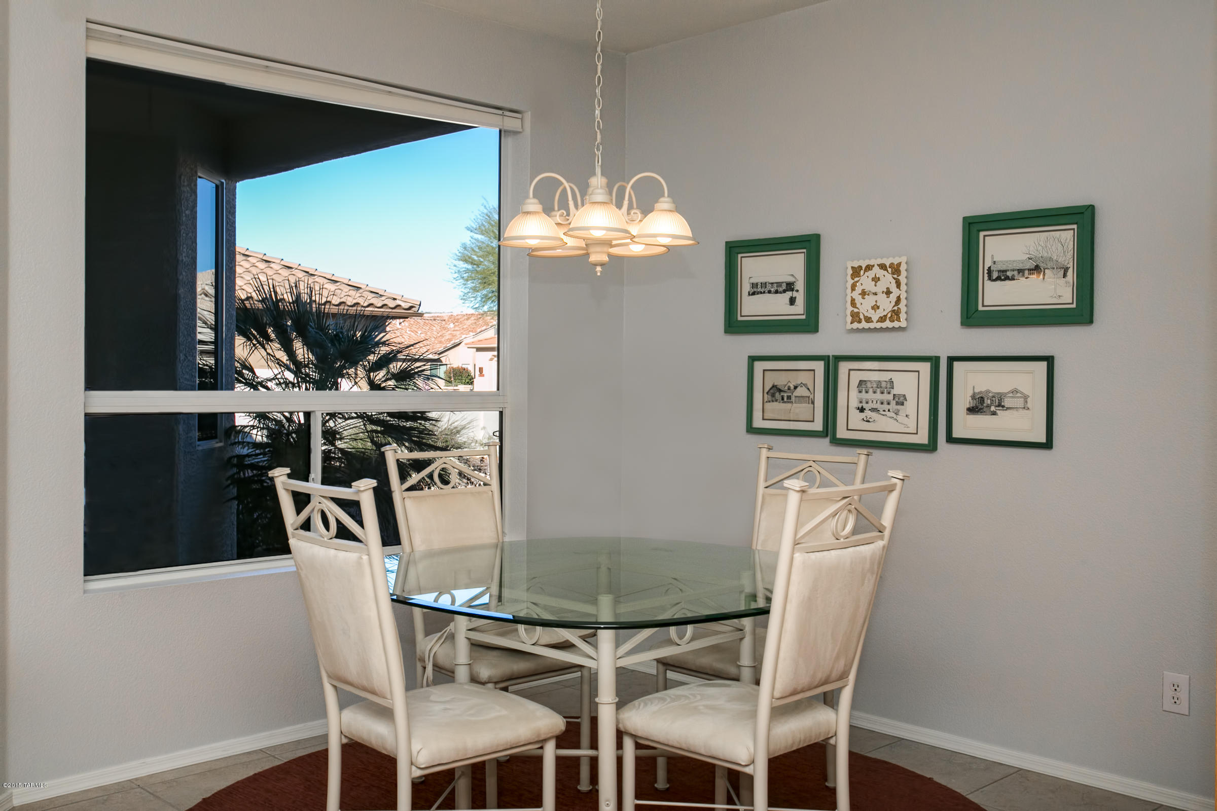 62419 East Northwood Road Tucson, AZ 85739 - Photo 18 of 30 a view of a dining room with furniture and a chandelier