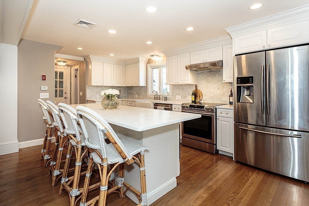 135 Governors Road Milton, MA 02186 - Photo 7 of 21 a kitchen with a sink appliances and cabinets