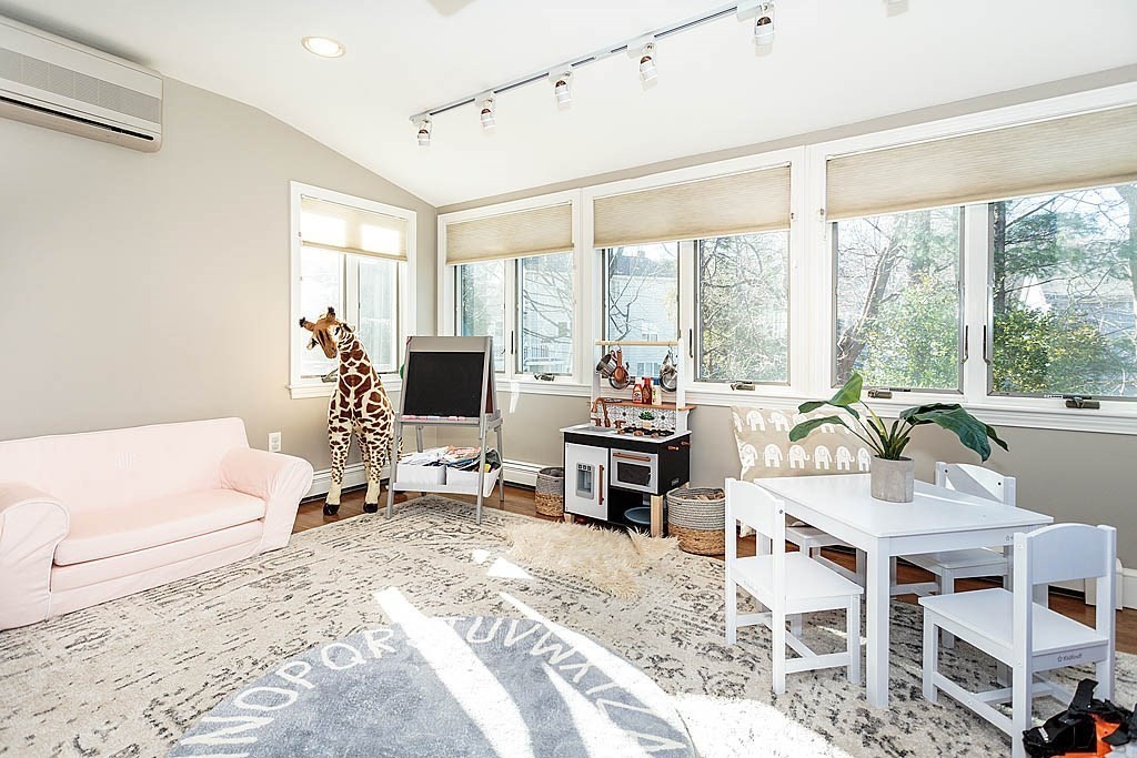 135 Governors Road Milton, MA 02186 - Photo 10 of 21 a living room with furniture a flat screen tv and a large window