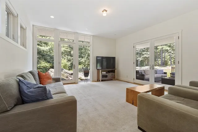a bathroom with a double vanity sink a mirror and a bathtub