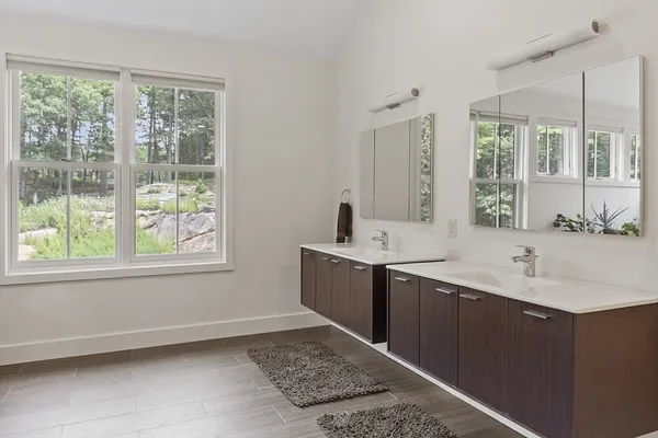 a bedroom with a bed lamp and window