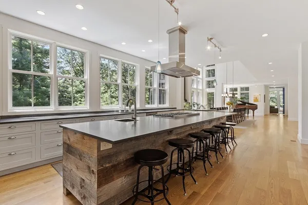 a kitchen with a stove a sink and a refrigerator