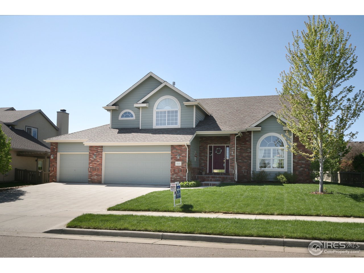 3147 Rookery Road Fort Collins, CO 80528 - Photo 1 of 18 a front view of a house with a yard